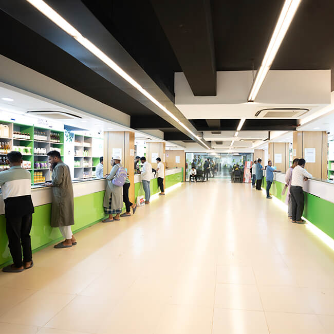 Ultimate Organic Life Aftabnagar Branch in Dhaka, showing customers at the counter of the well-lit organic food store
